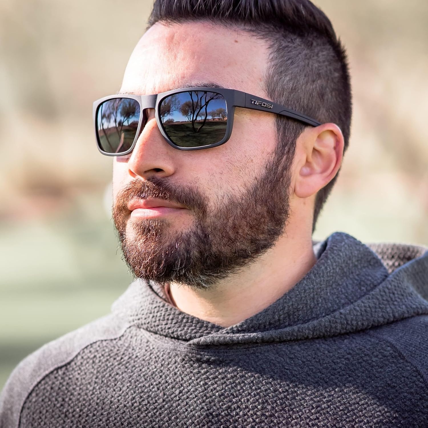 Tifosi Swick Lifestyle Sport Sunglasses – Cycling, Golf & Hiking | 100% UVA/UVB, shatterproof polycarbonate. Integrated hinge, hydrophilic nose pads. For cycling, golf, hiking & running.(Blackout/Smoke)